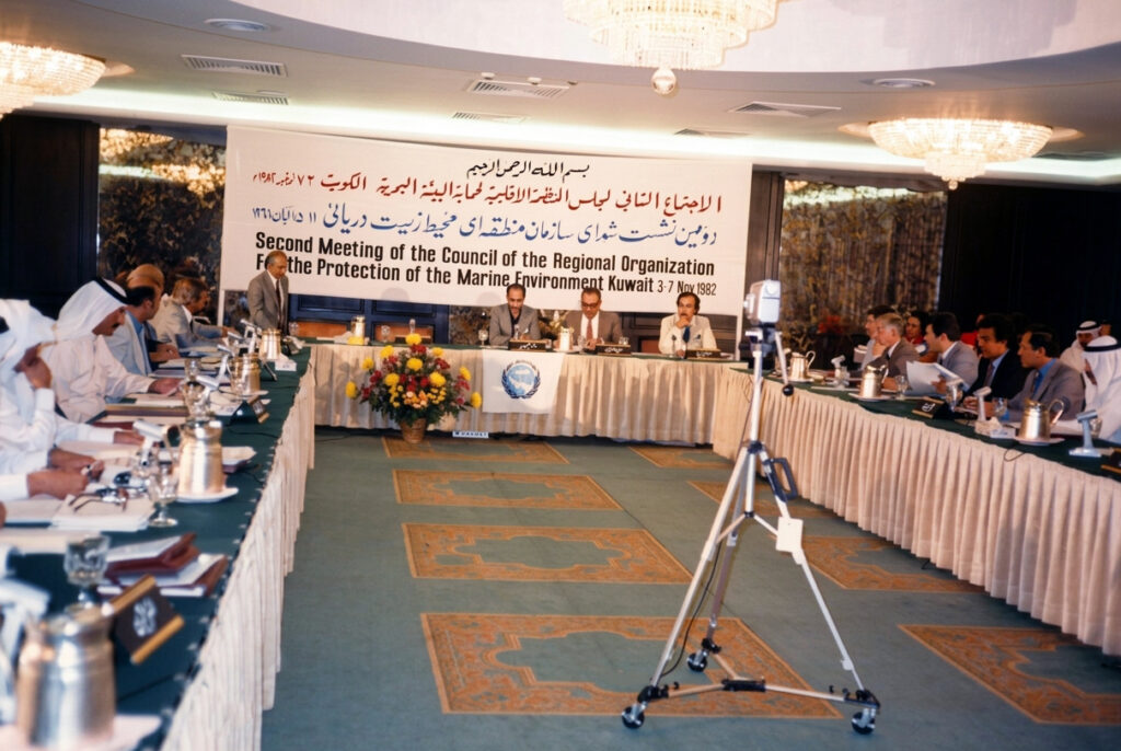 1982 Second meeting Delegates seated around a U‑shaped conference table at the Second Council Meeting of the Regional Organization for the Protection of the Marine Environment (ROPME), hosted in Kuwait on 6–7 November 1982, focused on strengthening institutional frameworks and implementing the Kuwait Regional Convention for marine pollution protection